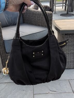 Kate Spade Black Nylon Bag With Unbranded Crown Bag Charm.